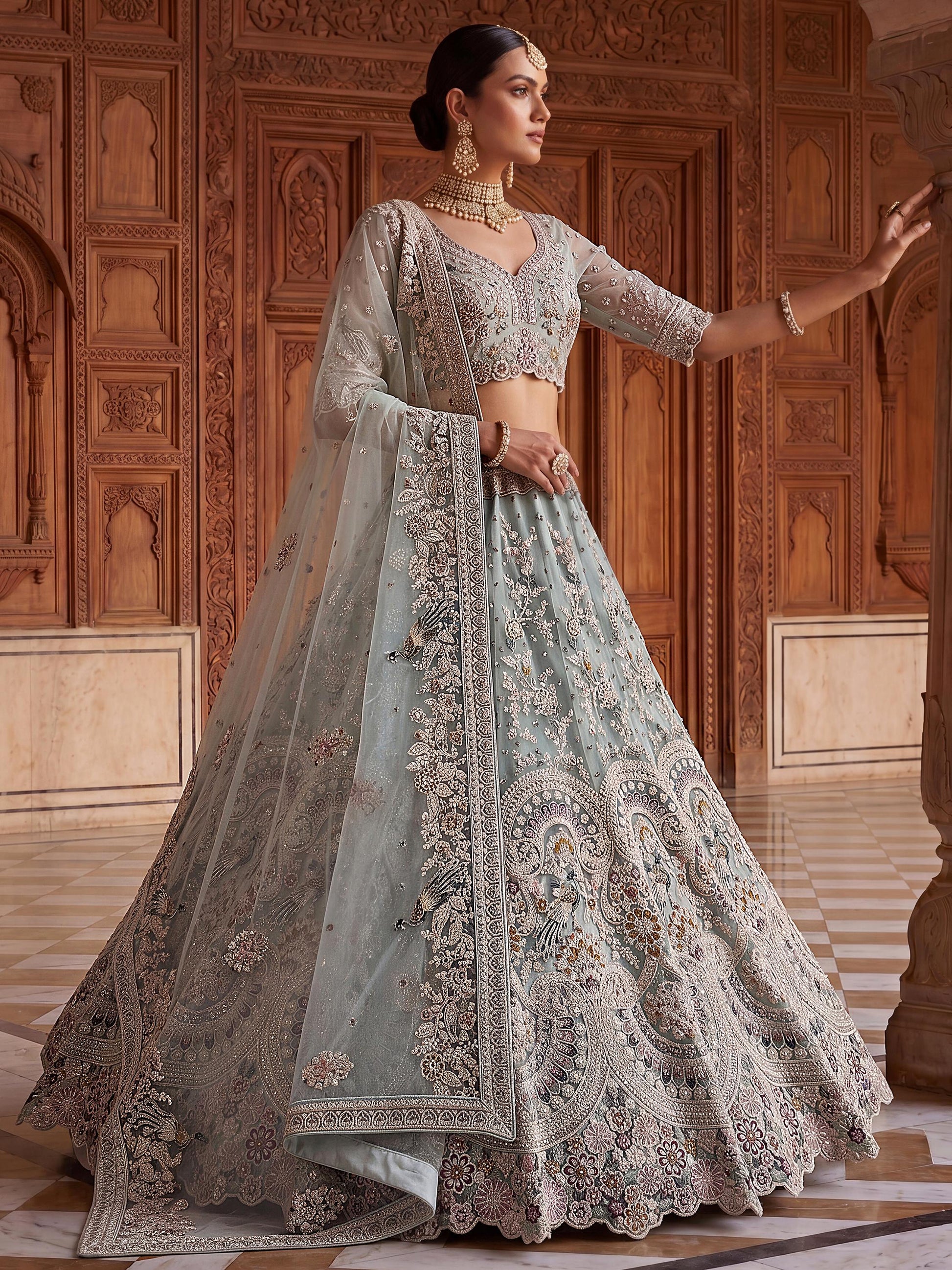 Elegant Sky-Blue Zari Work Net Bridal Wear Lehenga Choli With Dupatta
