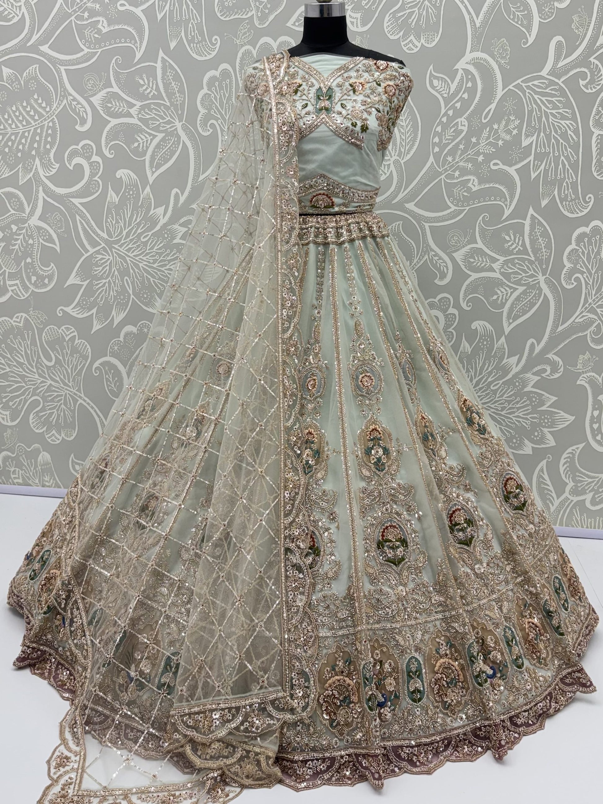 Graceful Mint Green Zari Work Net Wedding Wear Lehenga Choli