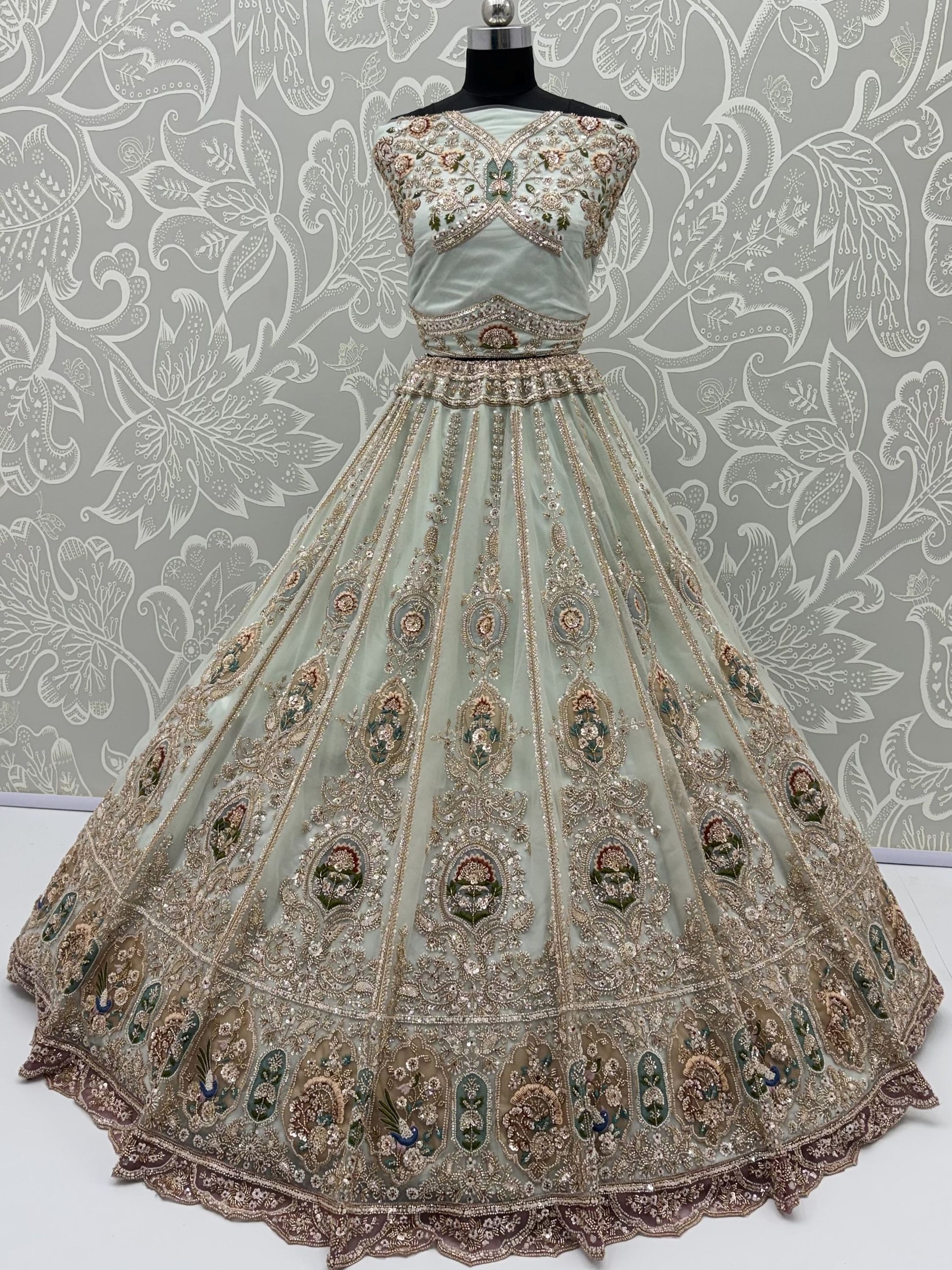 Graceful Mint Green Zari Work Net Wedding Wear Lehenga Choli