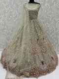 Exquisite Mint Green Zari Work Net Wedding Wear Lehenga Choli