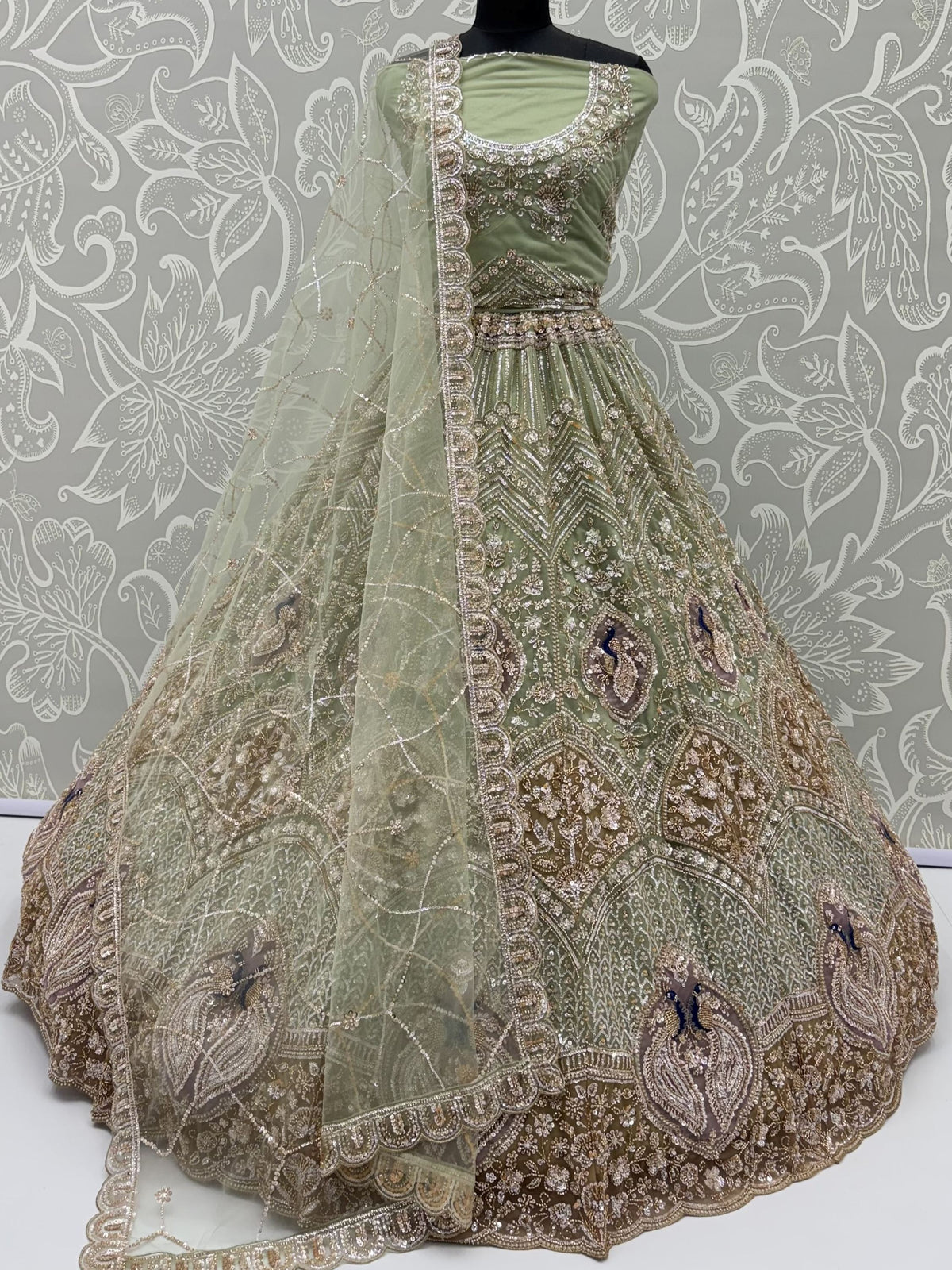 Exquisite Mint Green Zari Work Net Wedding Wear Lehenga Choli