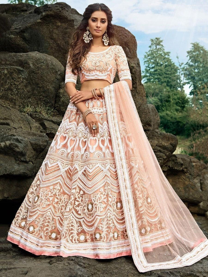 Glamorous Peach Sequins Net Engagement Wear Lehenga Choli With Dupatta