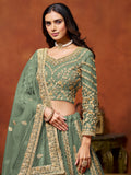 Rich Pista Green Zari Work Net Engagement Wear Lehenga Choli