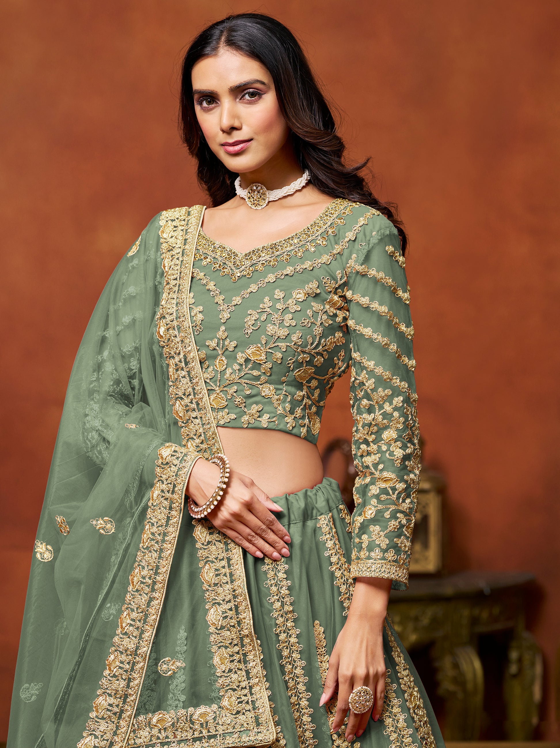 Rich Pista Green Zari Work Net Engagement Wear Lehenga Choli