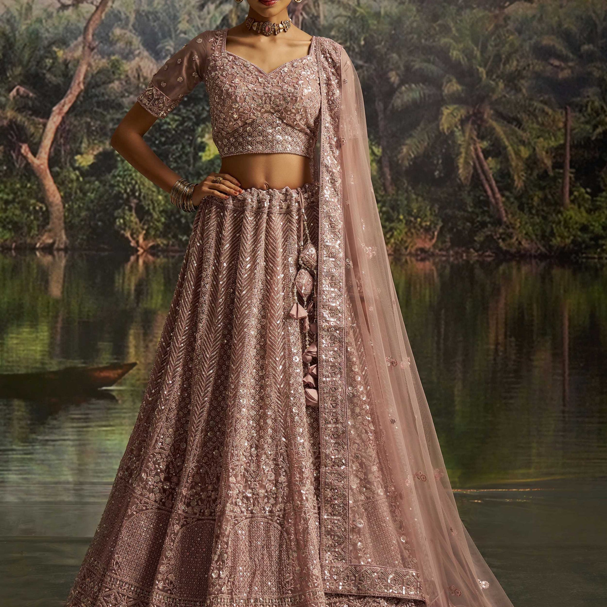 Gorgeous Mauve Sequins Net Reception Wear Lehenga Choli With Dupatta