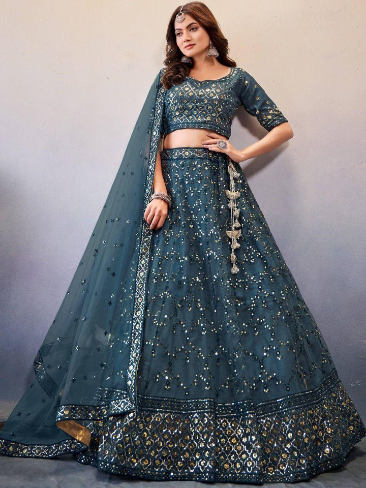 Enchanting Teal Blue Sequins Work Net Engagement Lehenga Choli