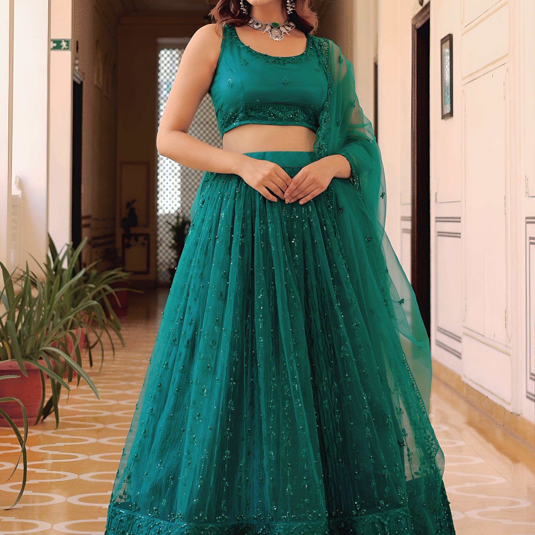 Delightful Teal Green Thread Embroidery Net Party Wear Lehenga Choli