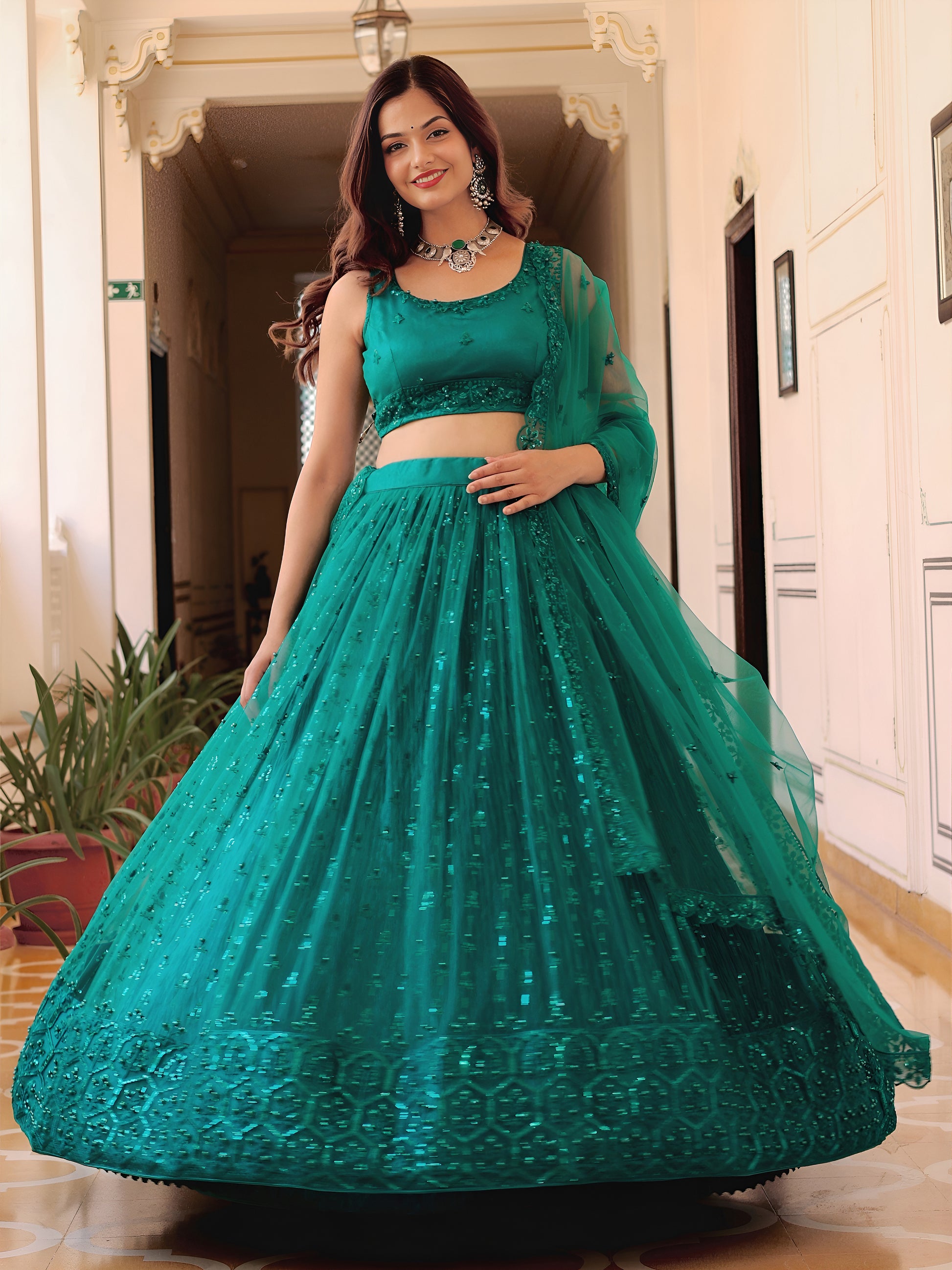 Delightful Teal Green Thread Embroidery Net Party Wear Lehenga Choli