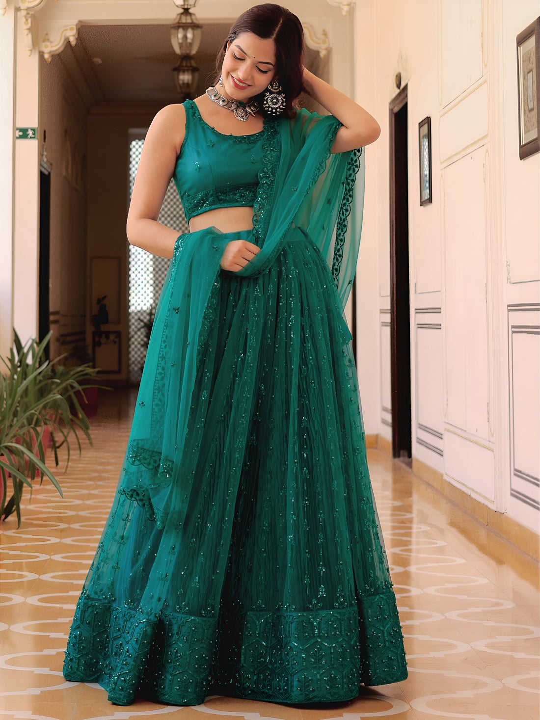 Delightful Teal Green Thread Embroidery Net Party Wear Lehenga Choli