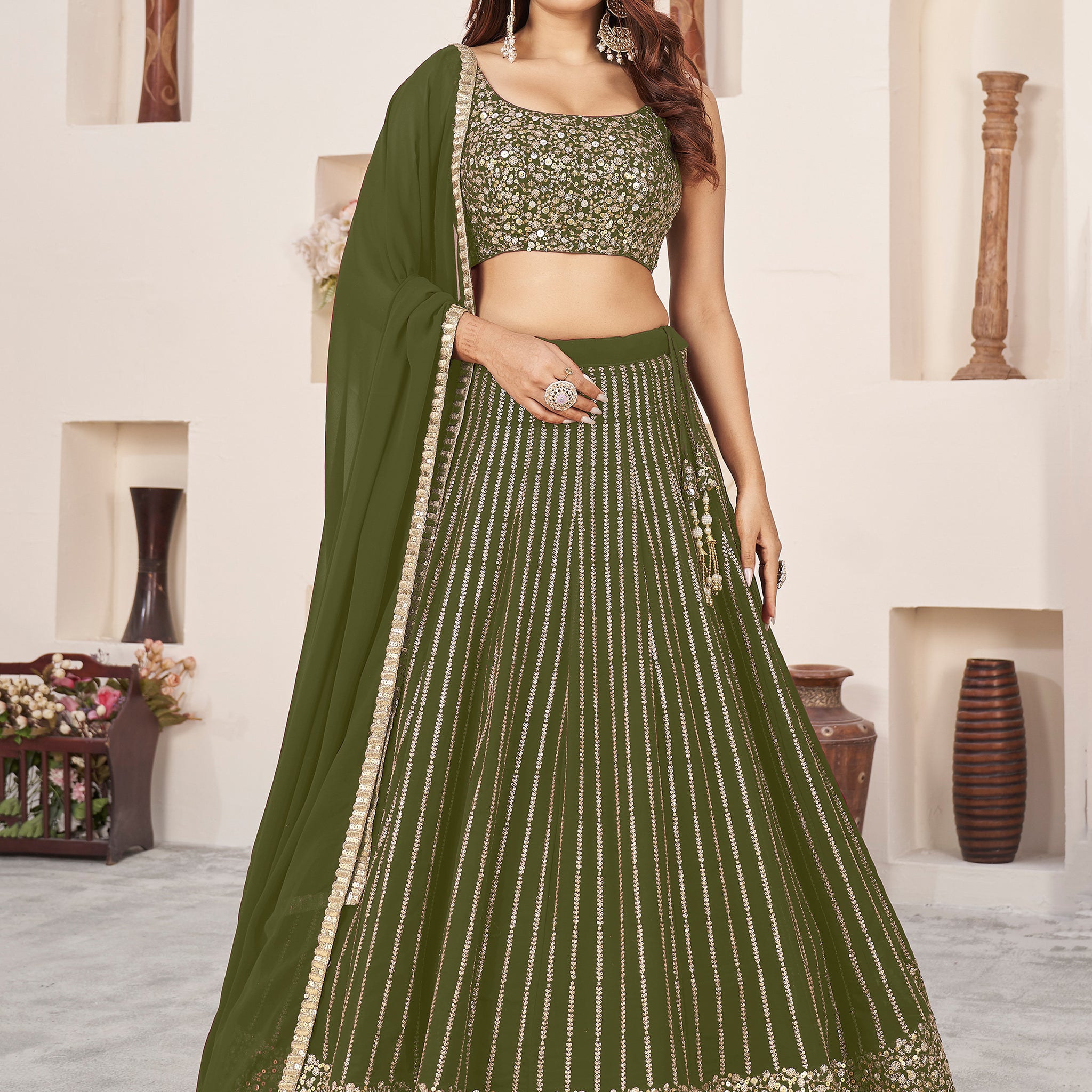 Outstanding Green Sequins Georgette Mehendi Wear Lehenga Choli