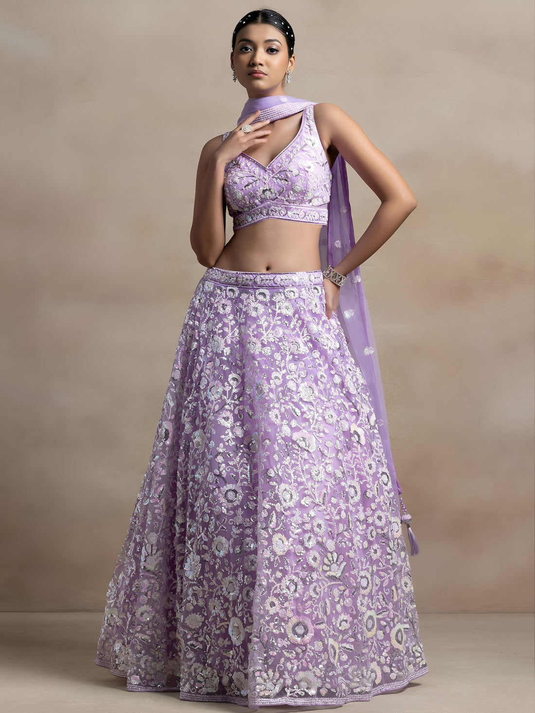 Surprising Lavender Sequins Net Reception Wear Lehenga Choli