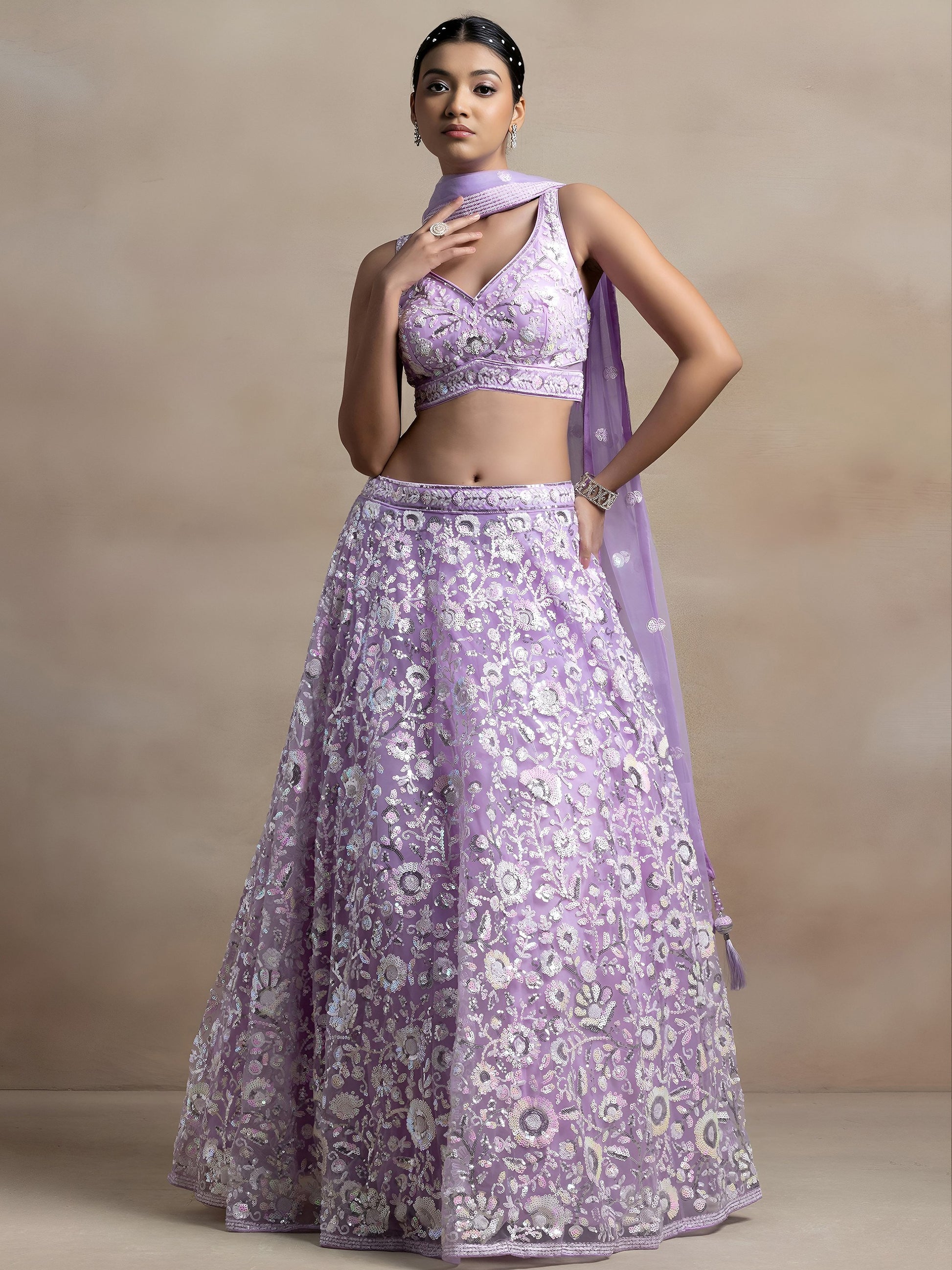 Surprising Lavender Sequins Net Reception Wear Lehenga Choli