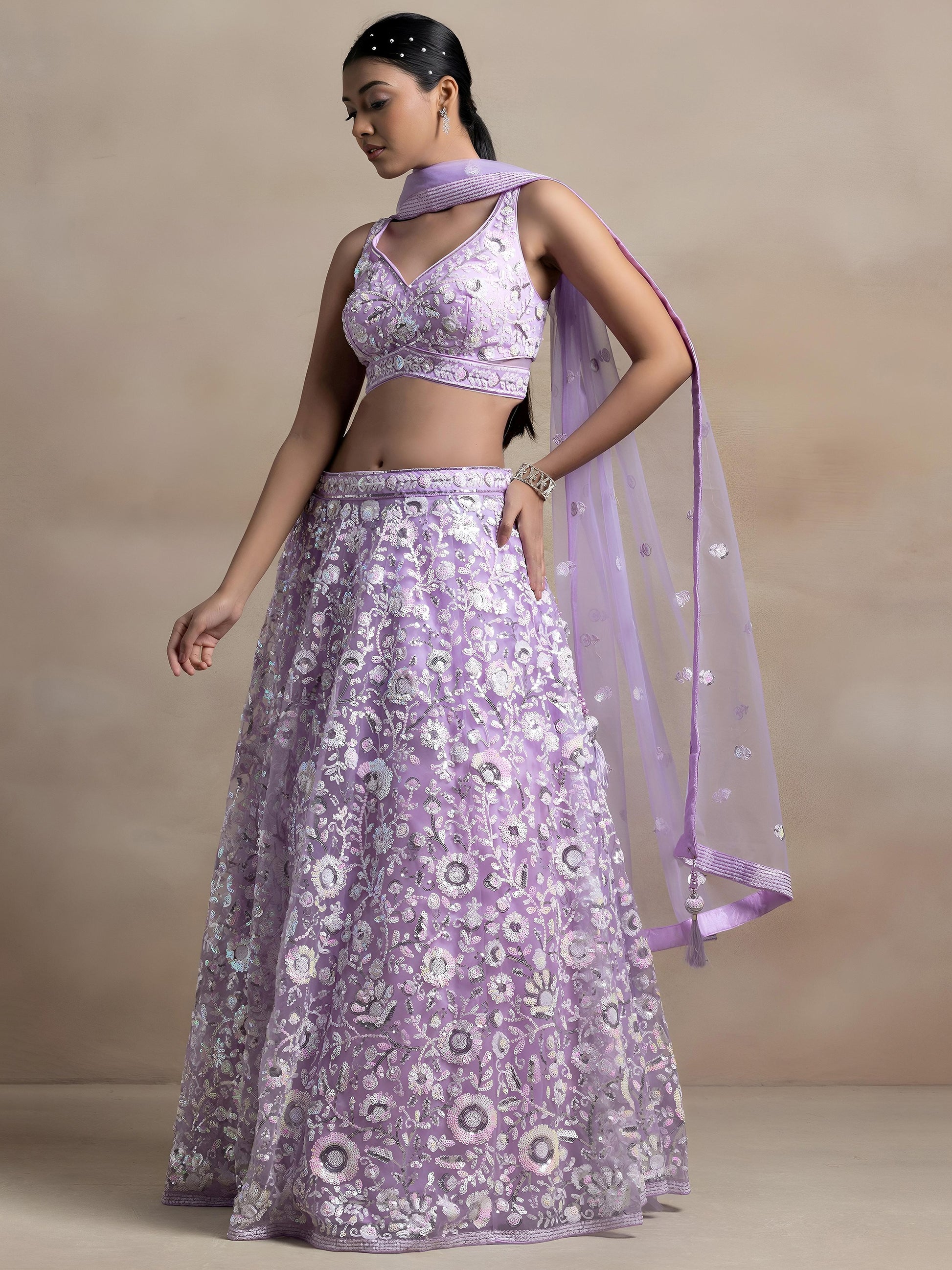 Surprising Lavender Sequins Net Reception Wear Lehenga Choli