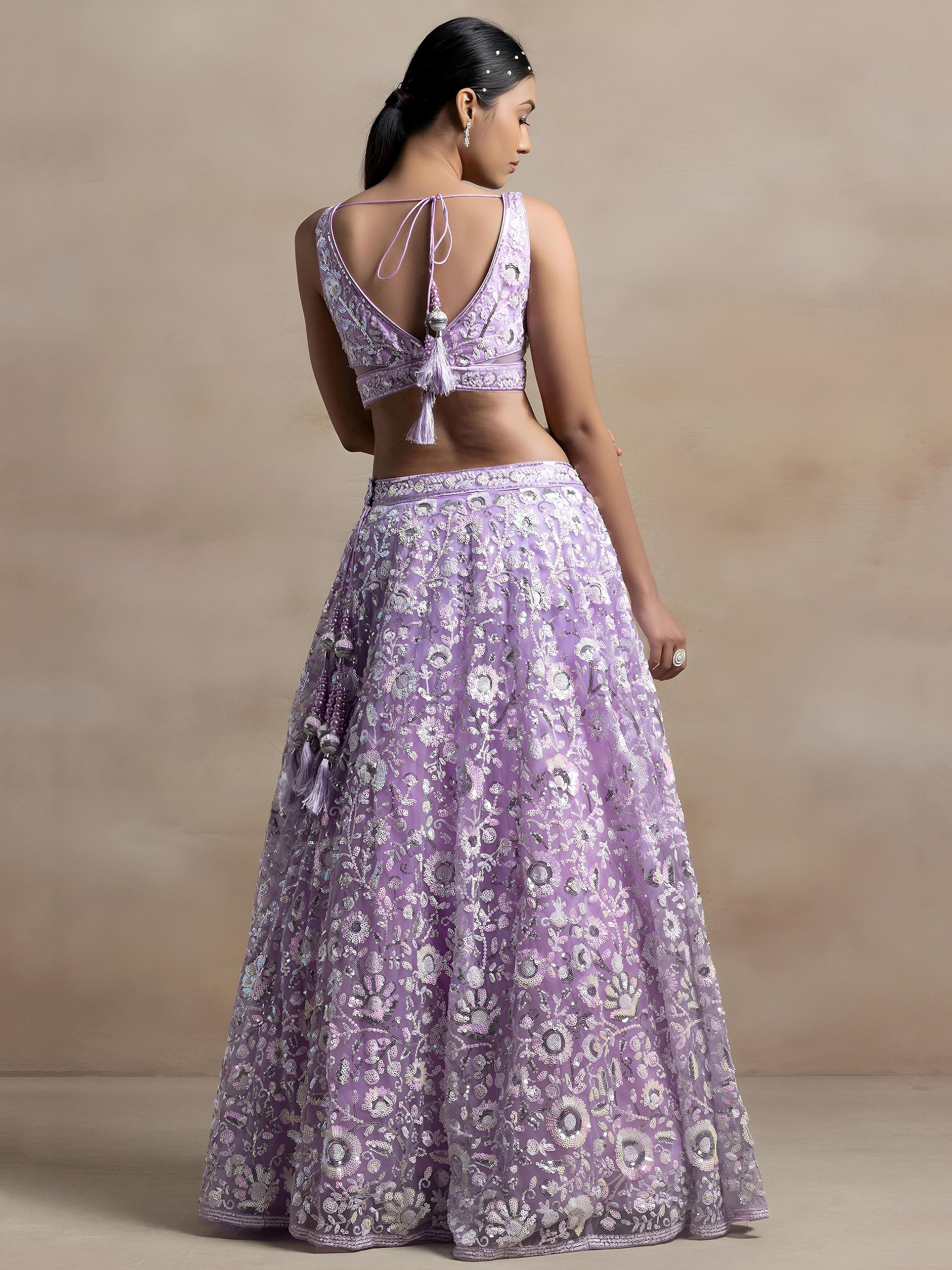 Surprising Lavender Sequins Net Reception Wear Lehenga Choli