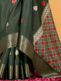 Make your upcoming celebrations truly special with this stunning green dola silk saree. The saree features a harmonious blend of foil print and zari weaving, adding a touch of sophistication and texture to its vibrant green hue.  With its intricate detailing and elegant design, this saree is perfect for festivals, events, and any occasion where you wish to make a memorable impression. Complementing the saree is a matching unstitched silk blouse, adorned with the same foil print and zari work. Measuring 5.50