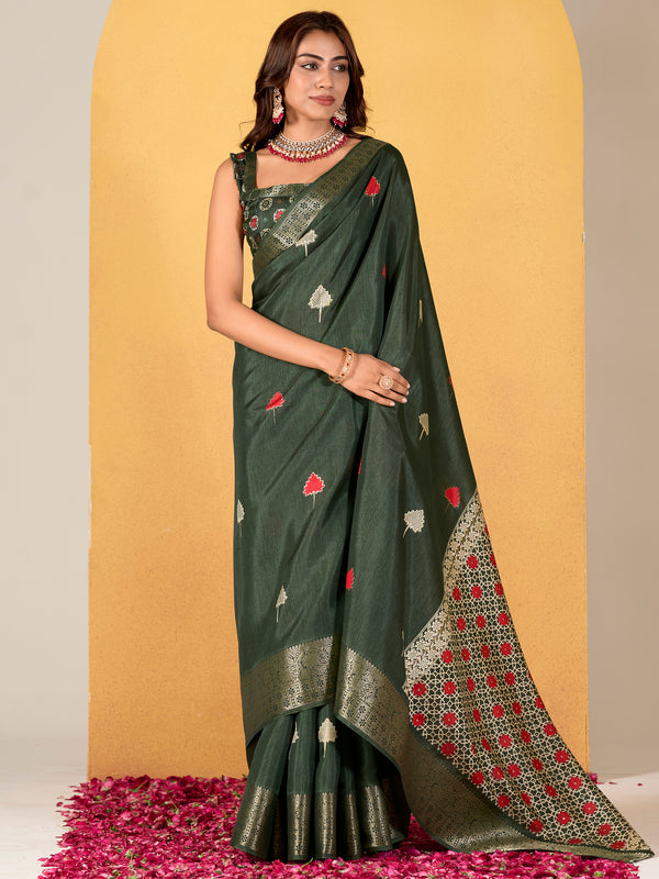 Make your upcoming celebrations truly special with this stunning green dola silk saree. The saree features a harmonious blend of foil print and zari weaving, adding a touch of sophistication and texture to its vibrant green hue.  With its intricate detailing and elegant design, this saree is perfect for festivals, events, and any occasion where you wish to make a memorable impression. Complementing the saree is a matching unstitched silk blouse, adorned with the same foil print and zari work. Measuring 5.50