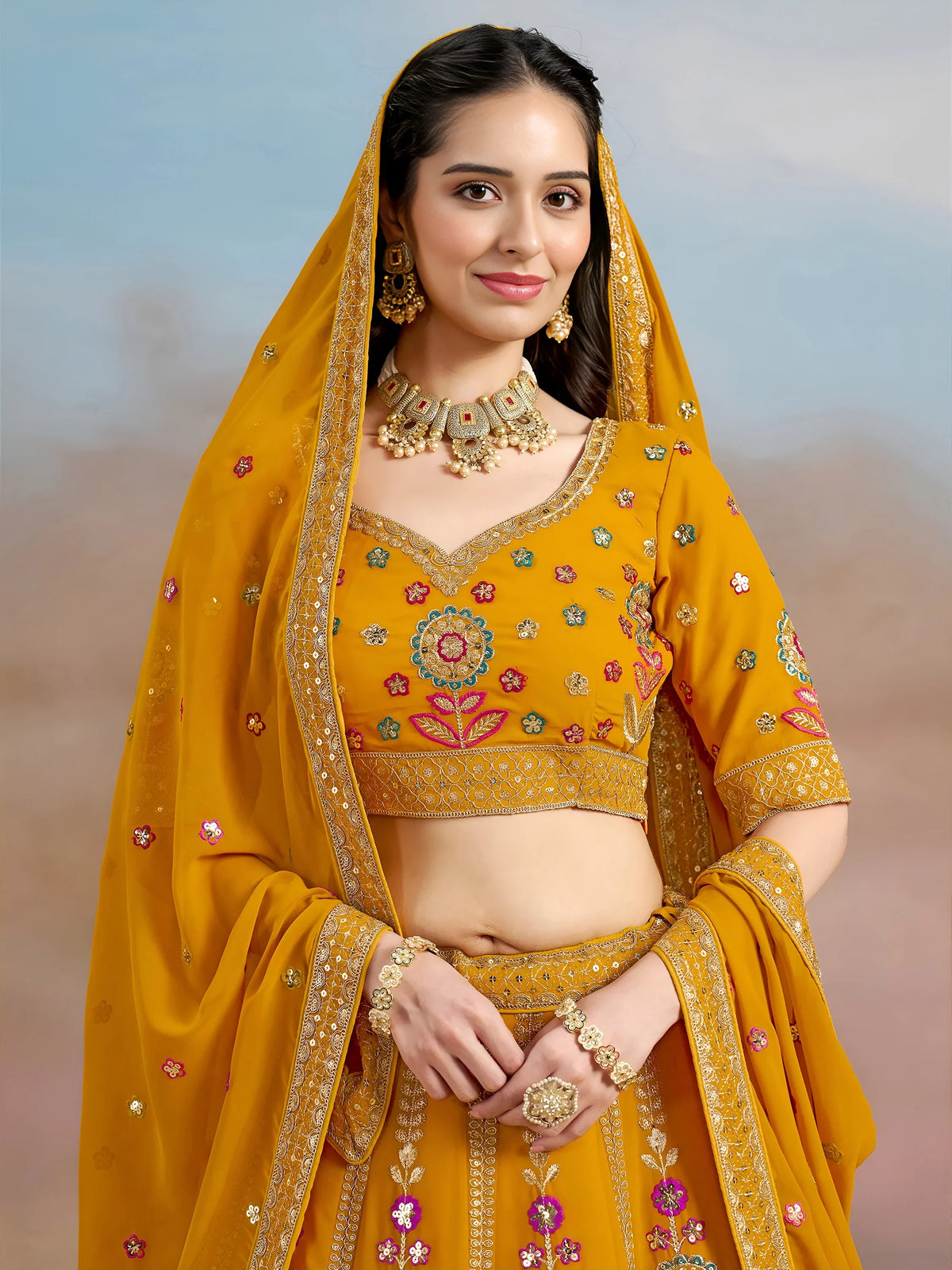 Pretty Yellow Thread Embroidered Georgette Haldi Wear Lehenga Choli
