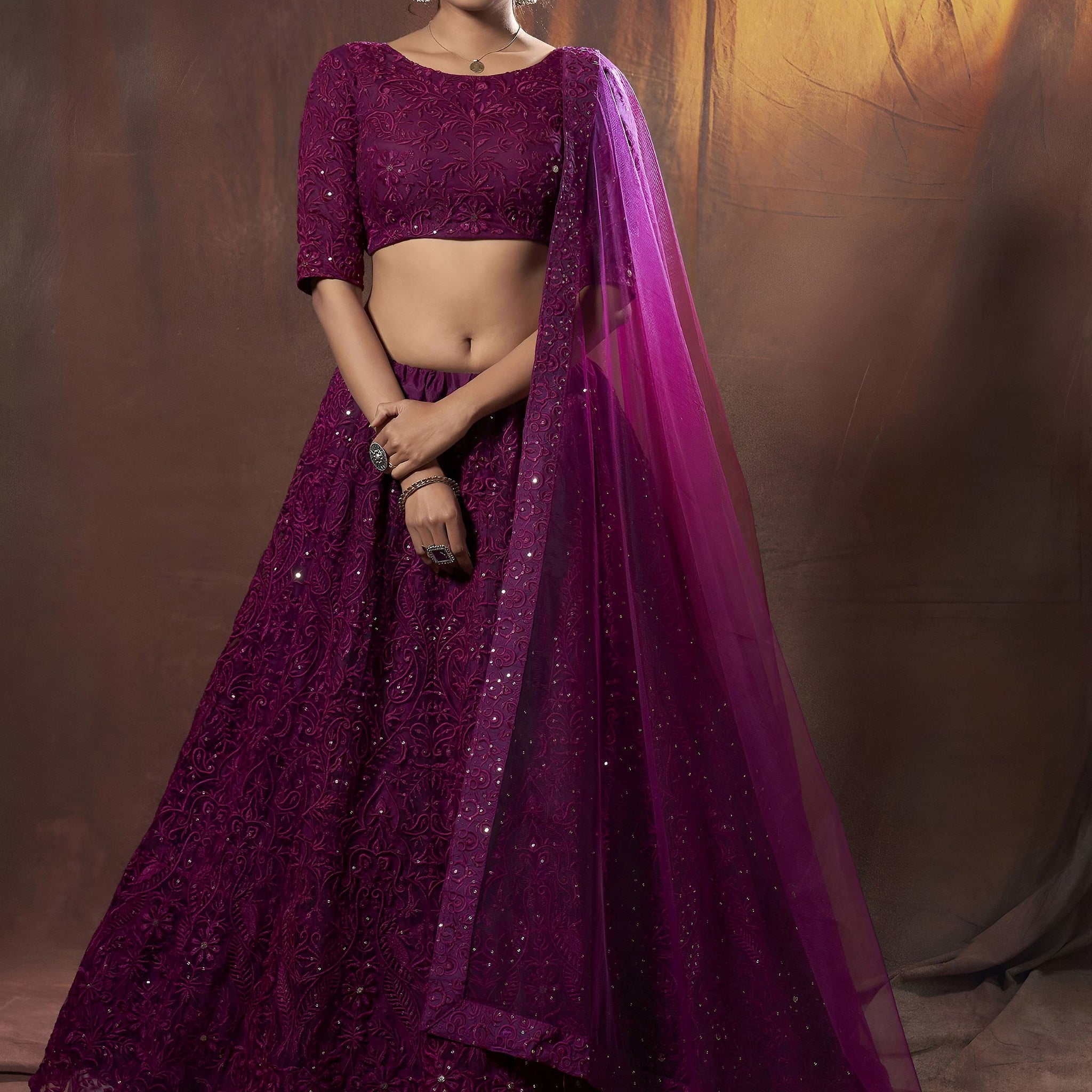 Alluring Purple Embroidered Net Reception Wear Lehenga Choli With Dupatta