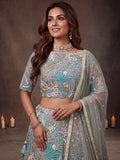 Elegant Pista Green Embroidered Net Wedding Wear Lehenga Choli With Dupatta