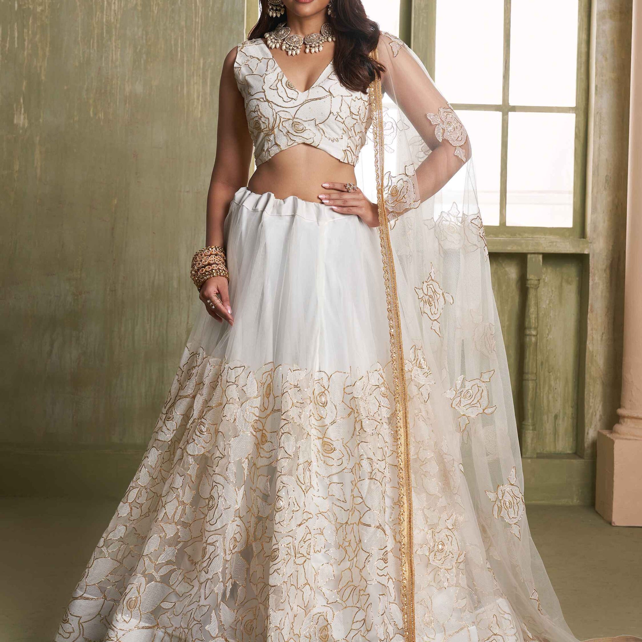 Amazing Off-White Embroidered Net Wedding Wear Lehenga Choli