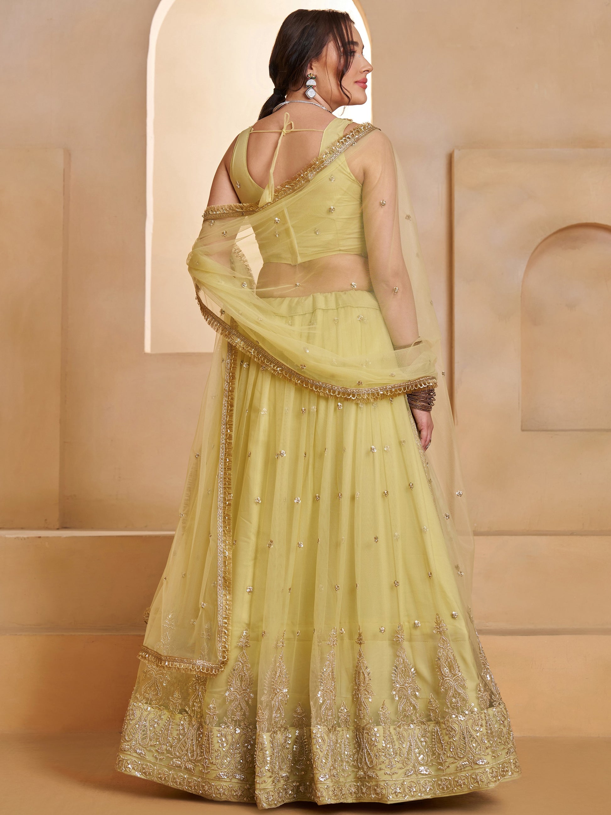 Sparkling Pastel Yellow Sequins Net Haldi Wear Lehenga Choli