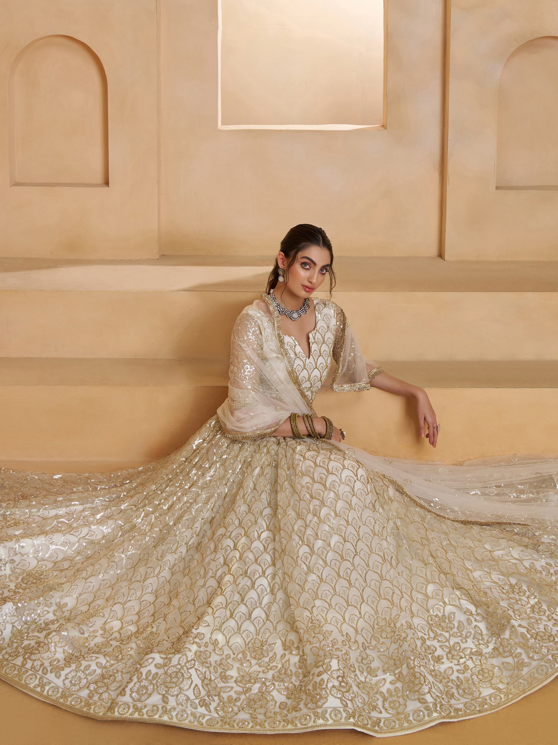 Elegant Off-White Thread Work Net Wedding Wear Lehenga Choli