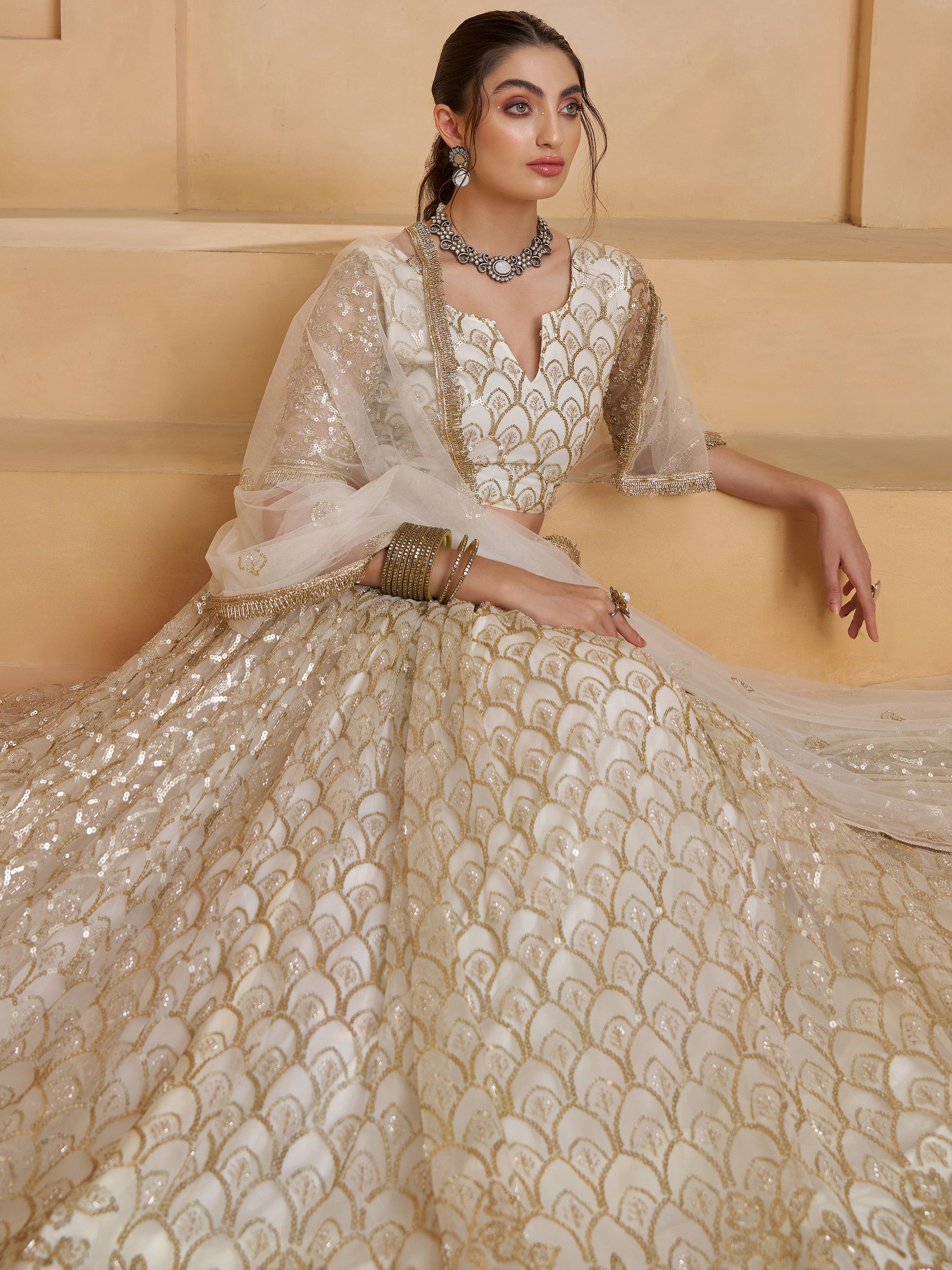 Elegant Off-White Thread Work Net Wedding Wear Lehenga Choli
