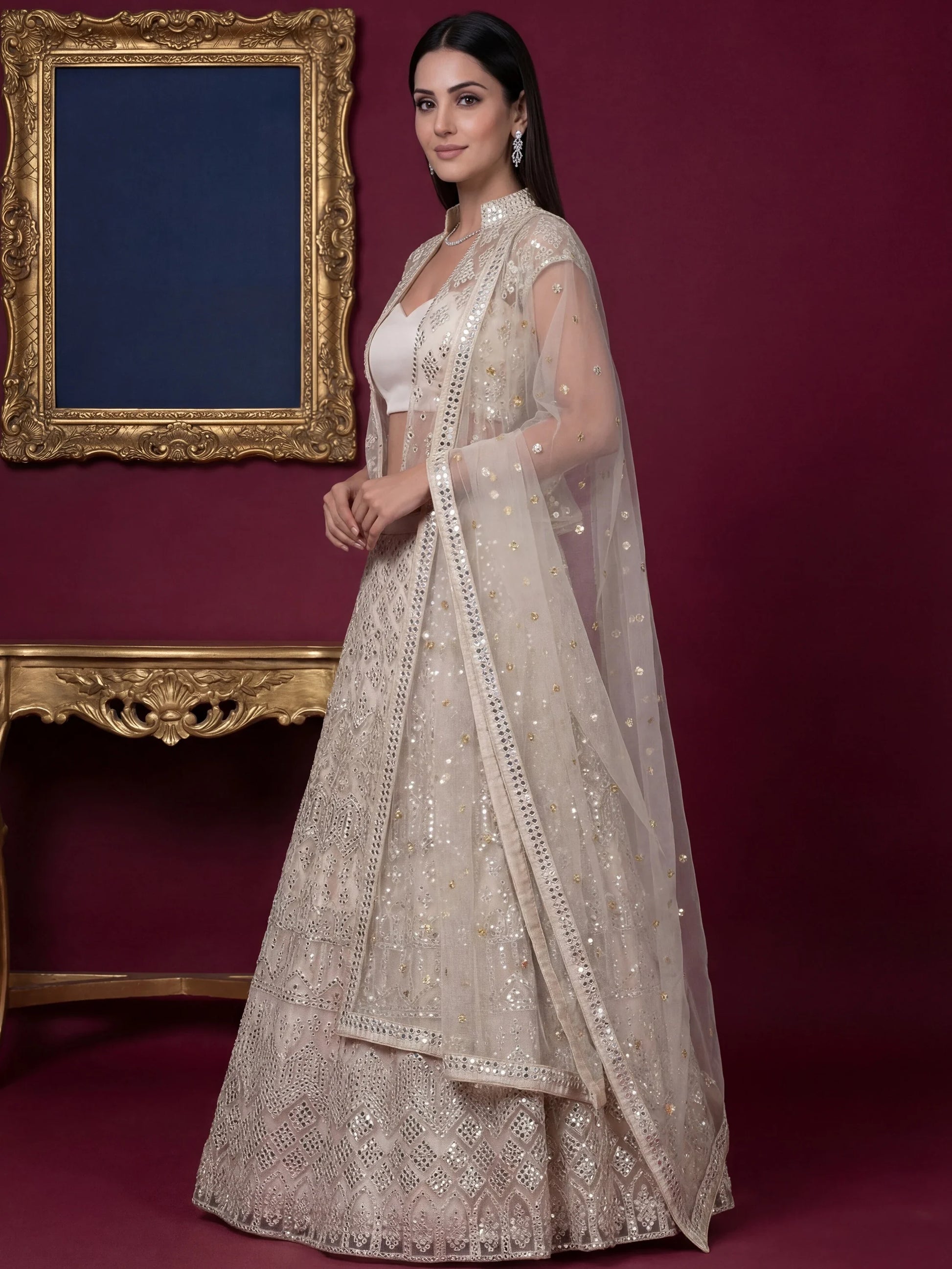 Rich Off-White Foil Work Net Reception Wear Lehenga Choli With Jacket