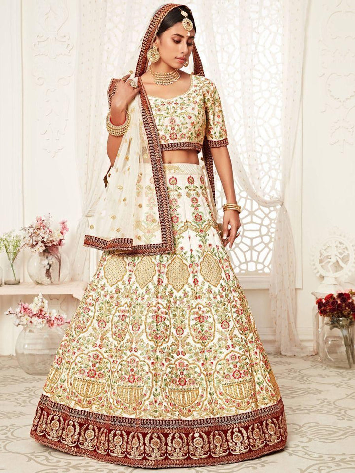 Enchanting Off White Embroidered Silk Wedding Wear Lehenga Choli