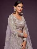 Attractive Lilac Embroidered Soft Net Wedding Wear Lehenga Choli