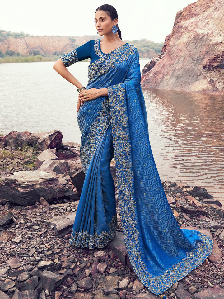 Stunning Blue Heavy Embroidered Satin Wedding Wear Saree With Blouse