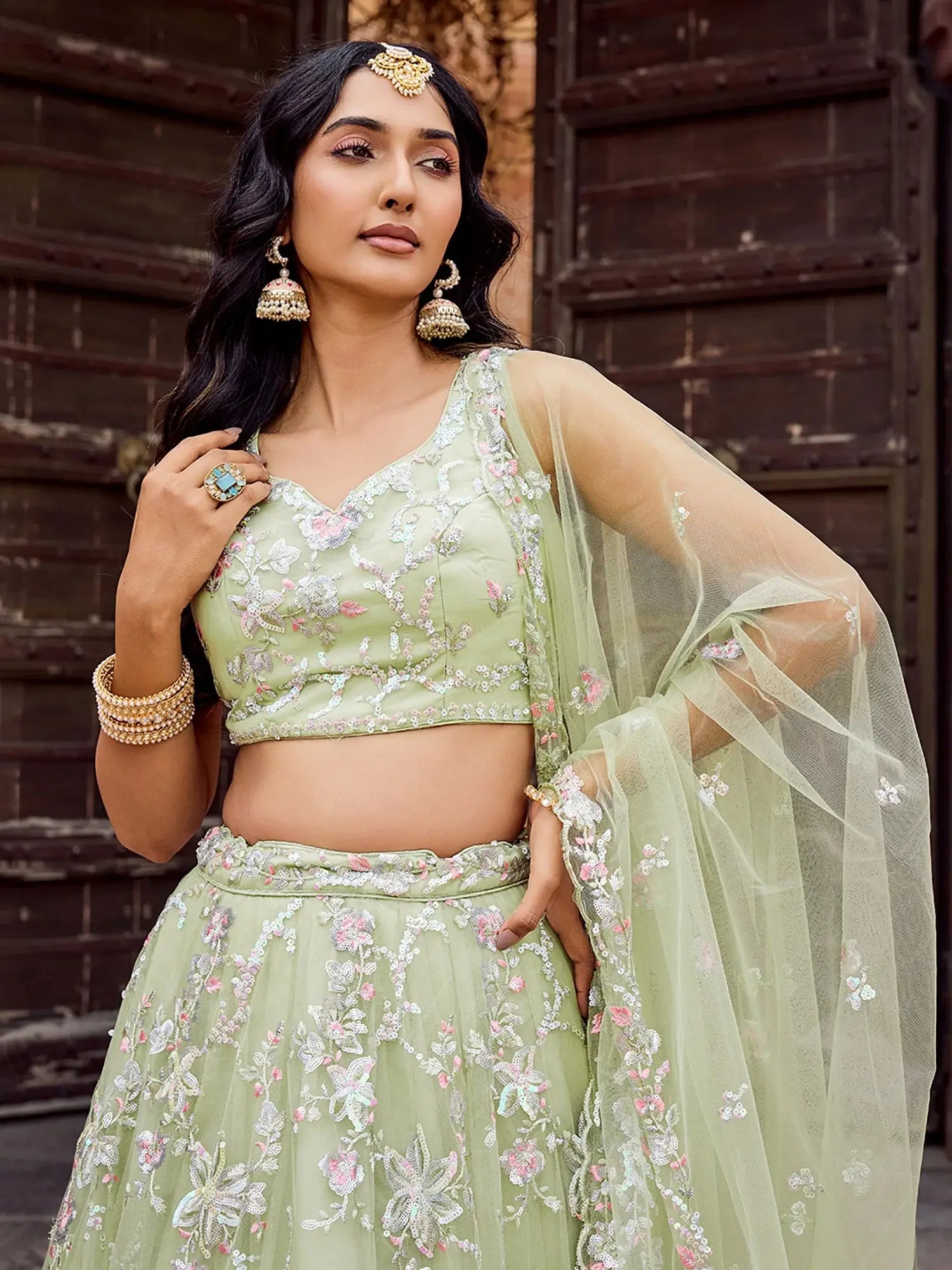 Pretty Pista Green Sequins Embroidery Net Mehendi Wear Lehenga With Blouse