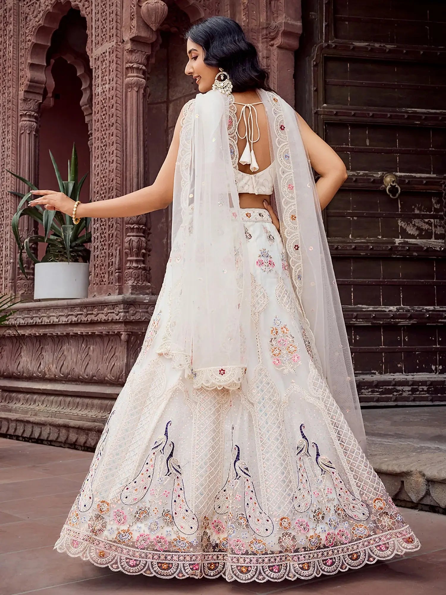 Wonderful Cream Floral Embroidered Net Evening Wear Lehenga Choli