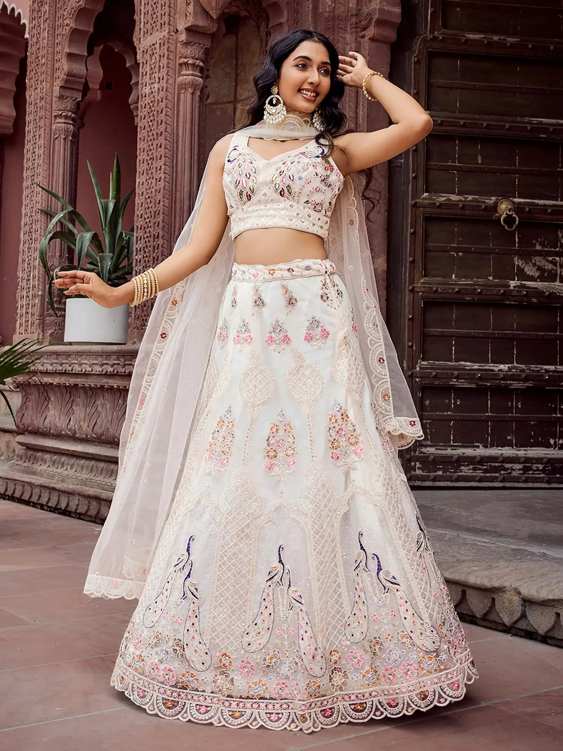 Wonderful Cream Floral Embroidered Net Evening Wear Lehenga Choli