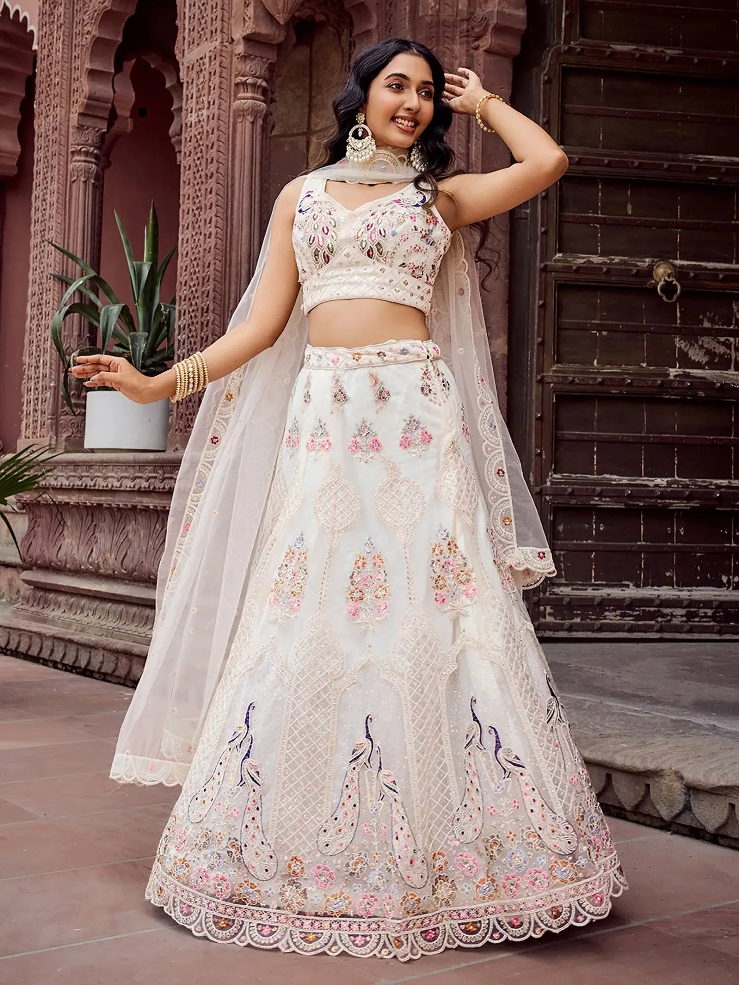 Wonderful Cream Floral Embroidered Net Evening Wear Lehenga Choli