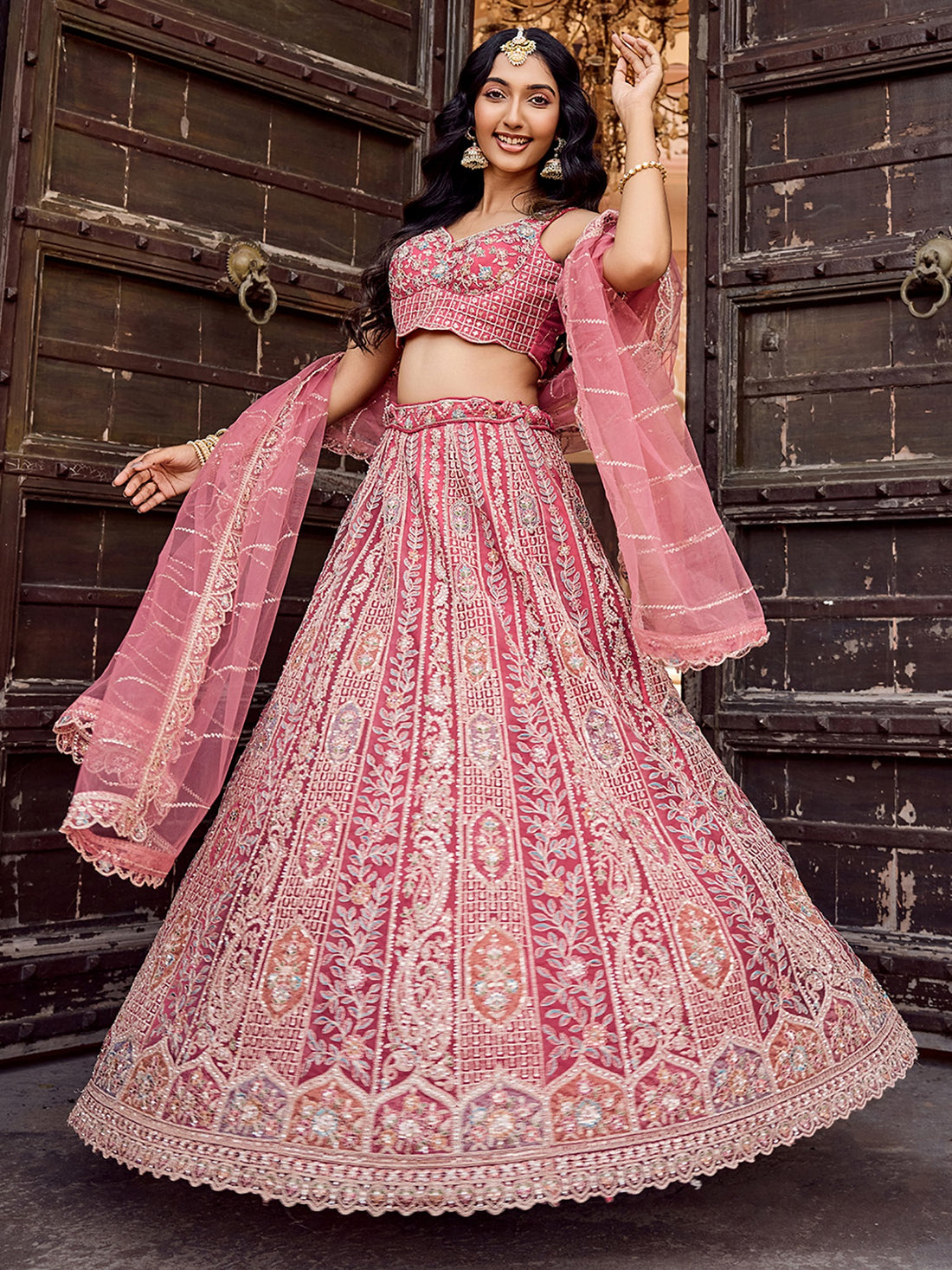 Regal Rose Gold Net Embroidered Engagement Wear Lehenga Choli With Dupatta