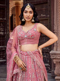 Regal Rose Gold Net Embroidered Engagement Wear Lehenga Choli With Dupatta