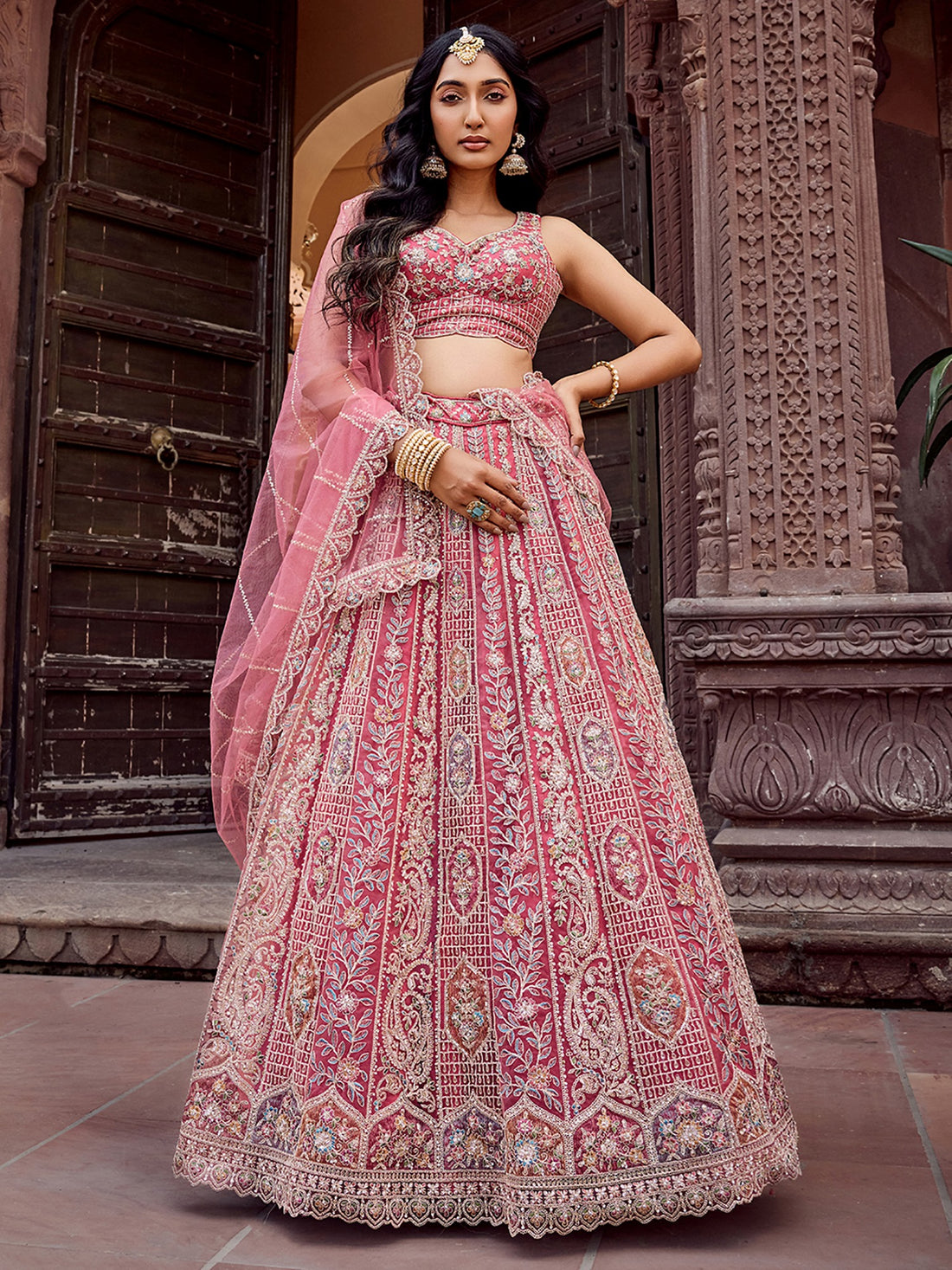 Regal Rose Gold Net Embroidered Engagement Wear Lehenga Choli With Dupatta