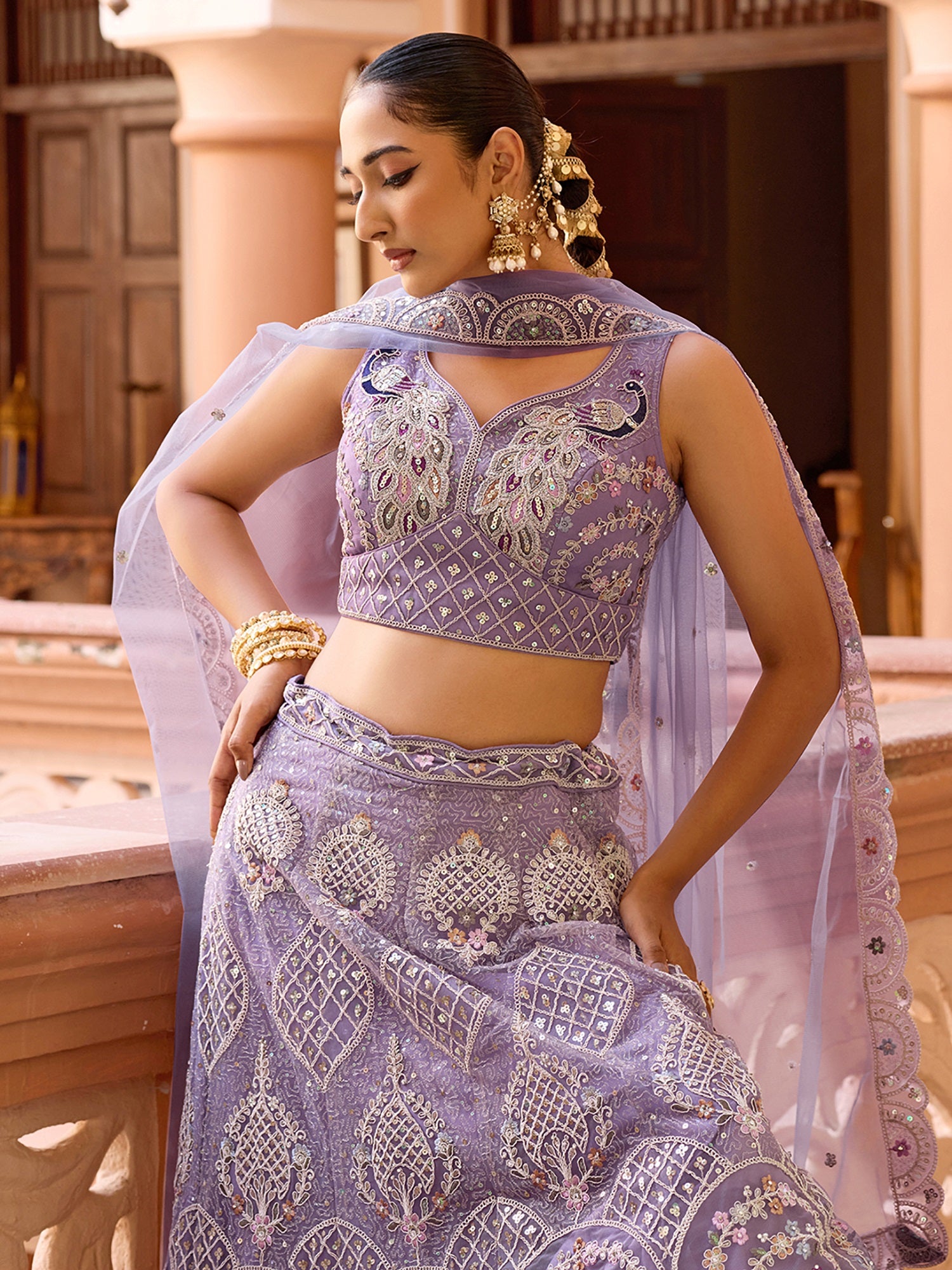 Glamours Mauve Floral Embroidered Net Reception Wear Lehenga With Blouse