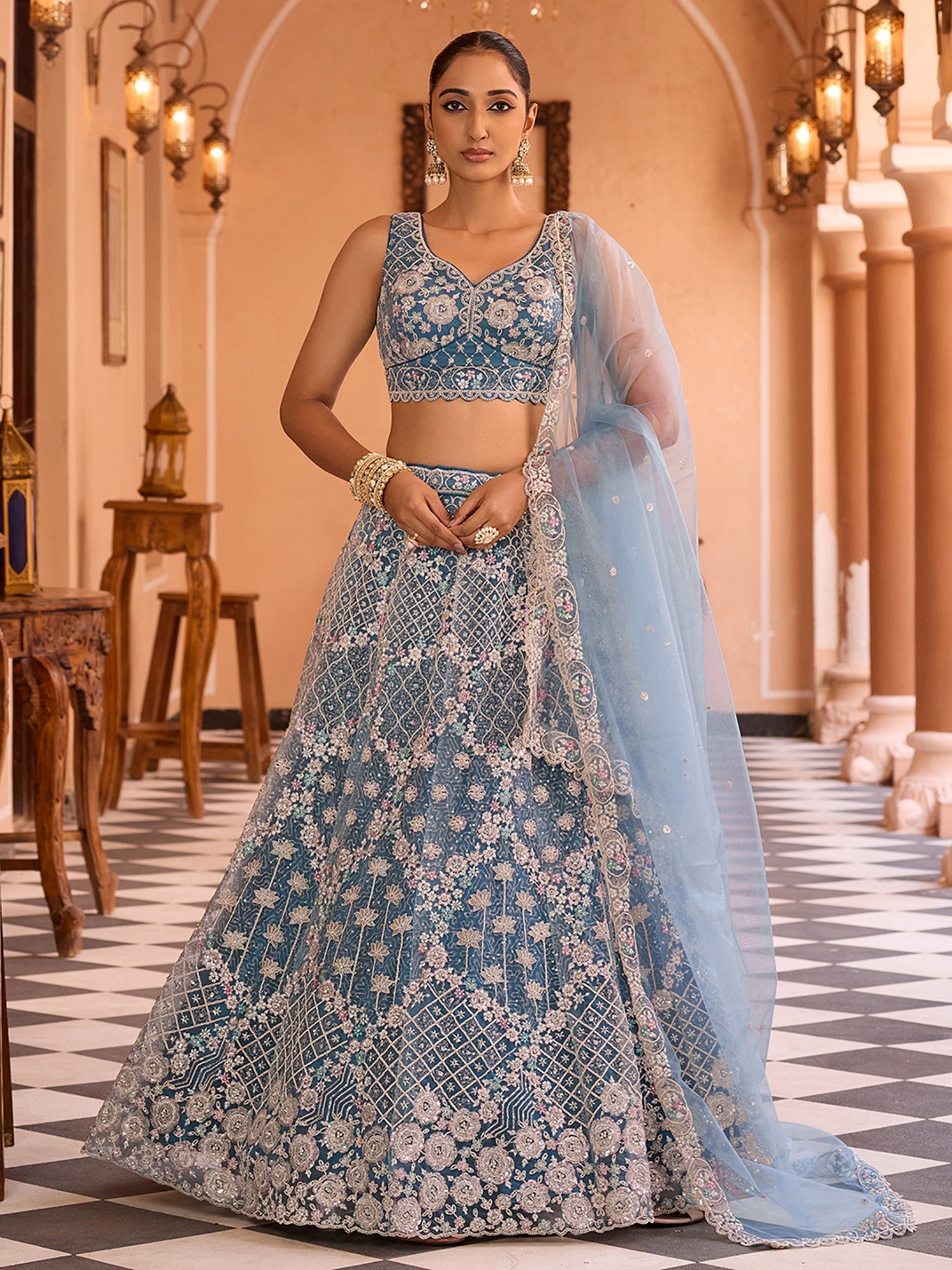 Ravishing Teal Blue Net Embroidered Engagement Wear Lehenga With Blouse