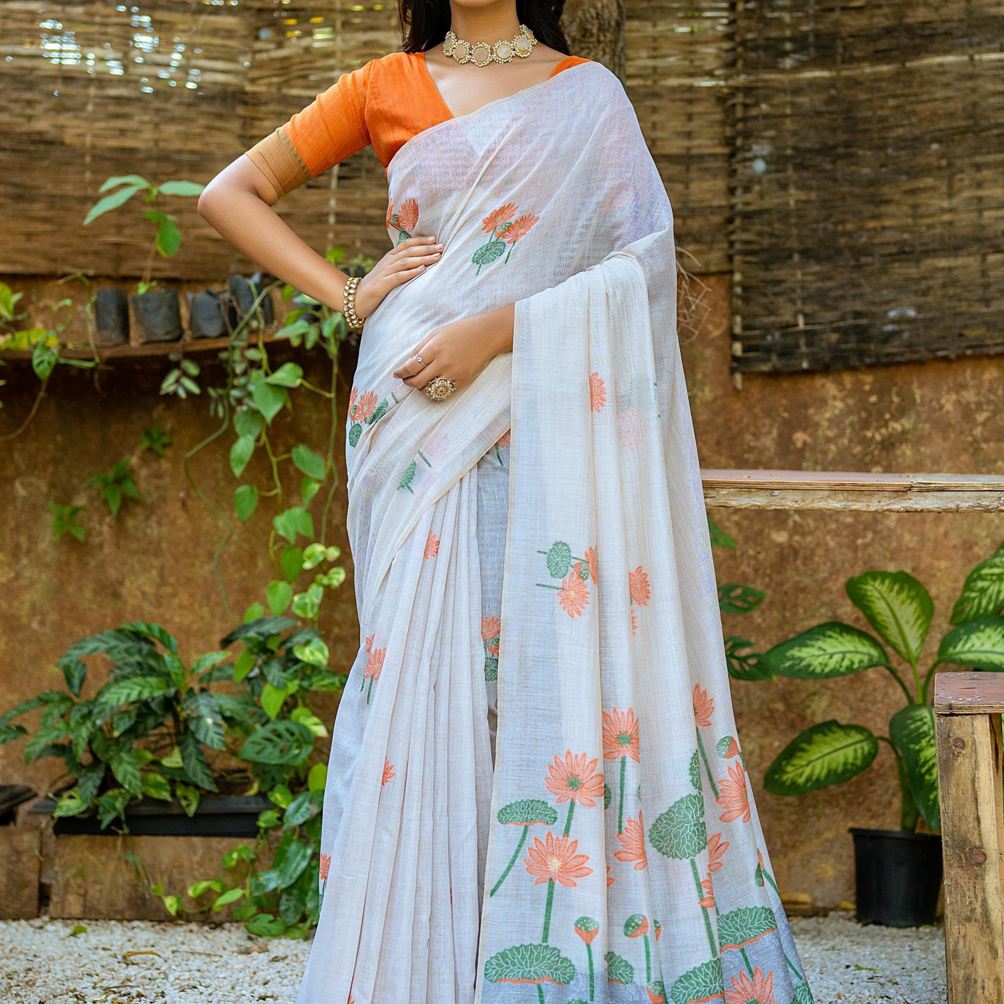 Pretty Off-White Floral Printed Cotton Casual Wear Saree With Orange Blouse