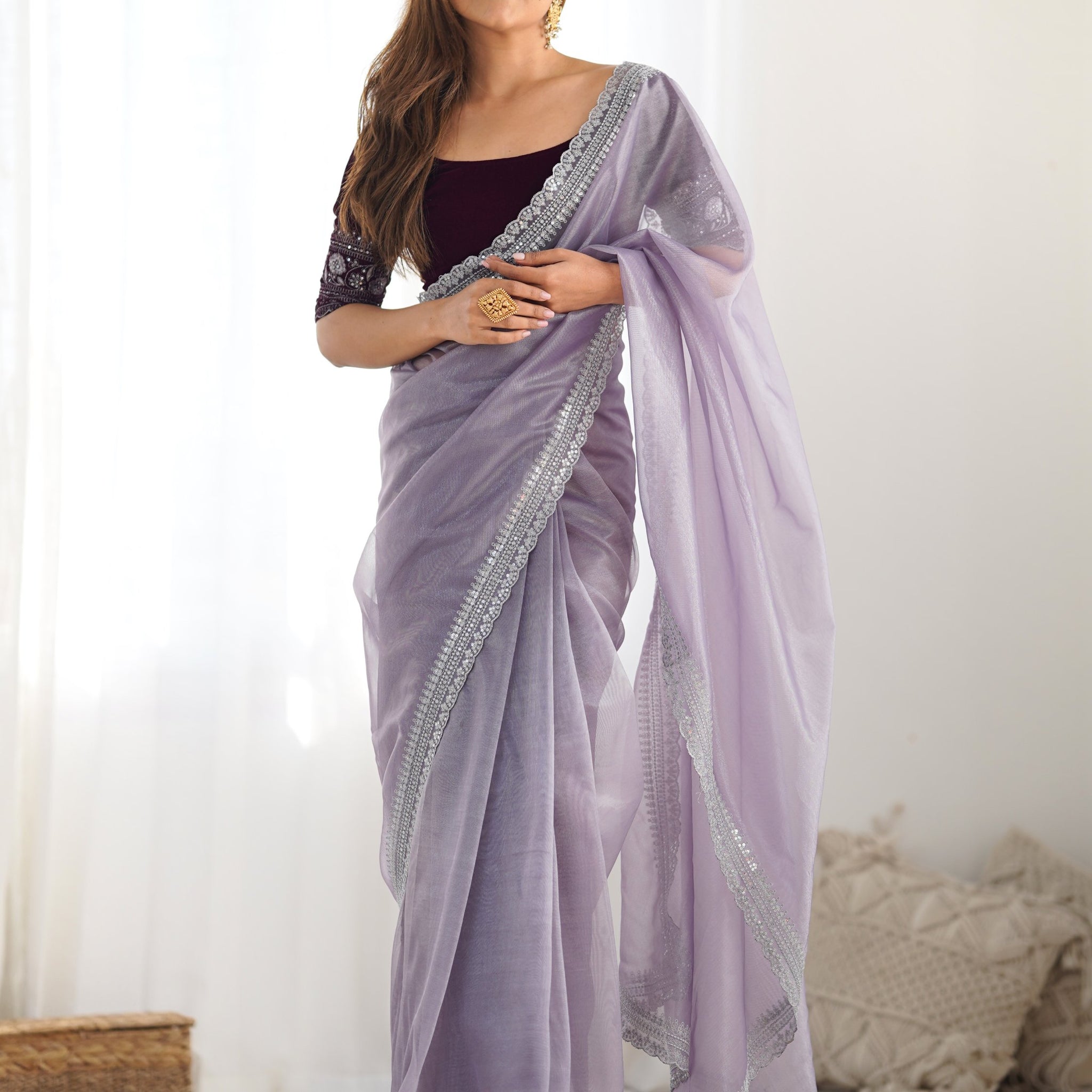Stunning Lavender Sequins Border Work Net Saree With Blouse