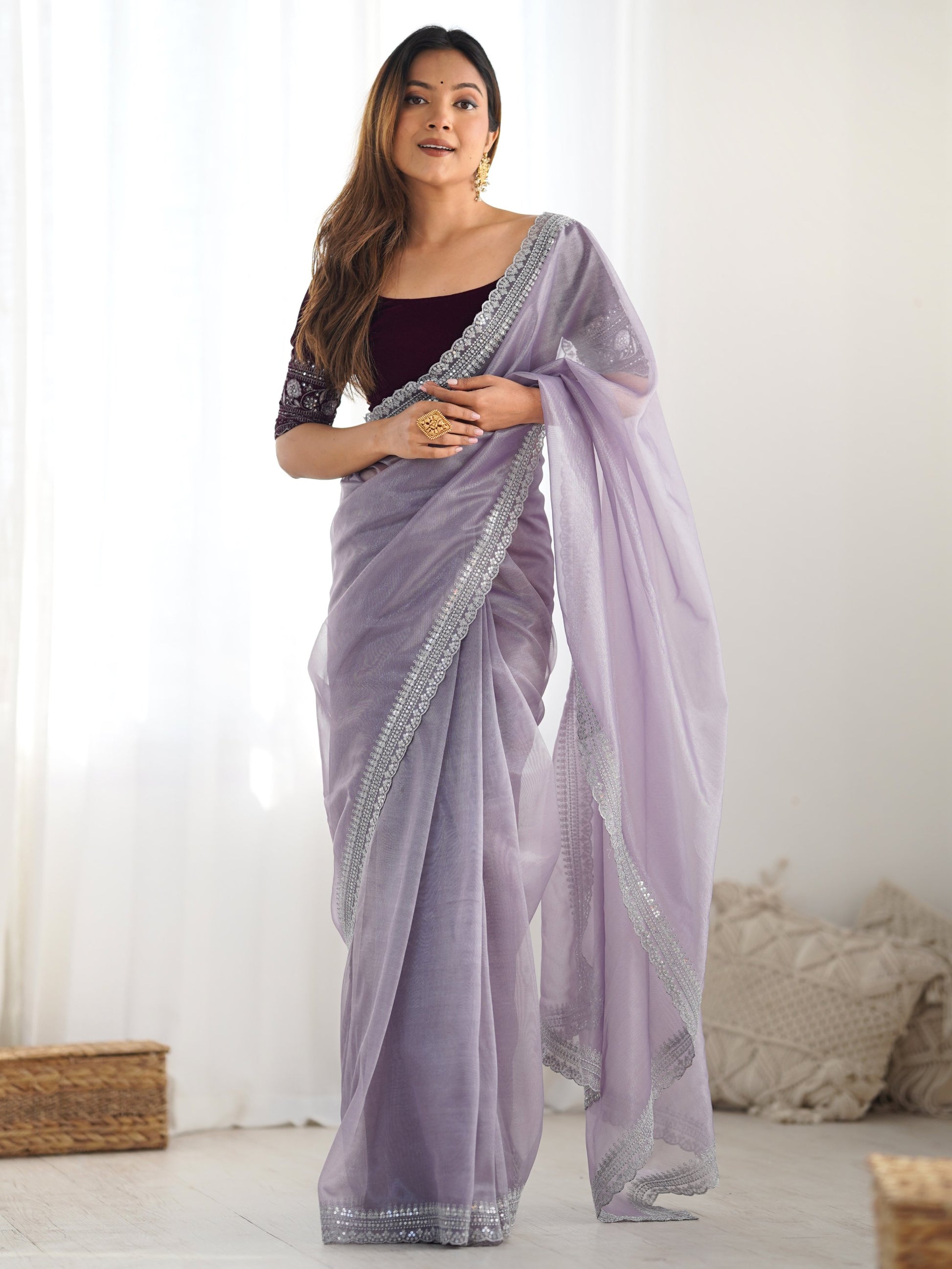 Stunning Lavender Sequins Border Work Net Saree With Blouse