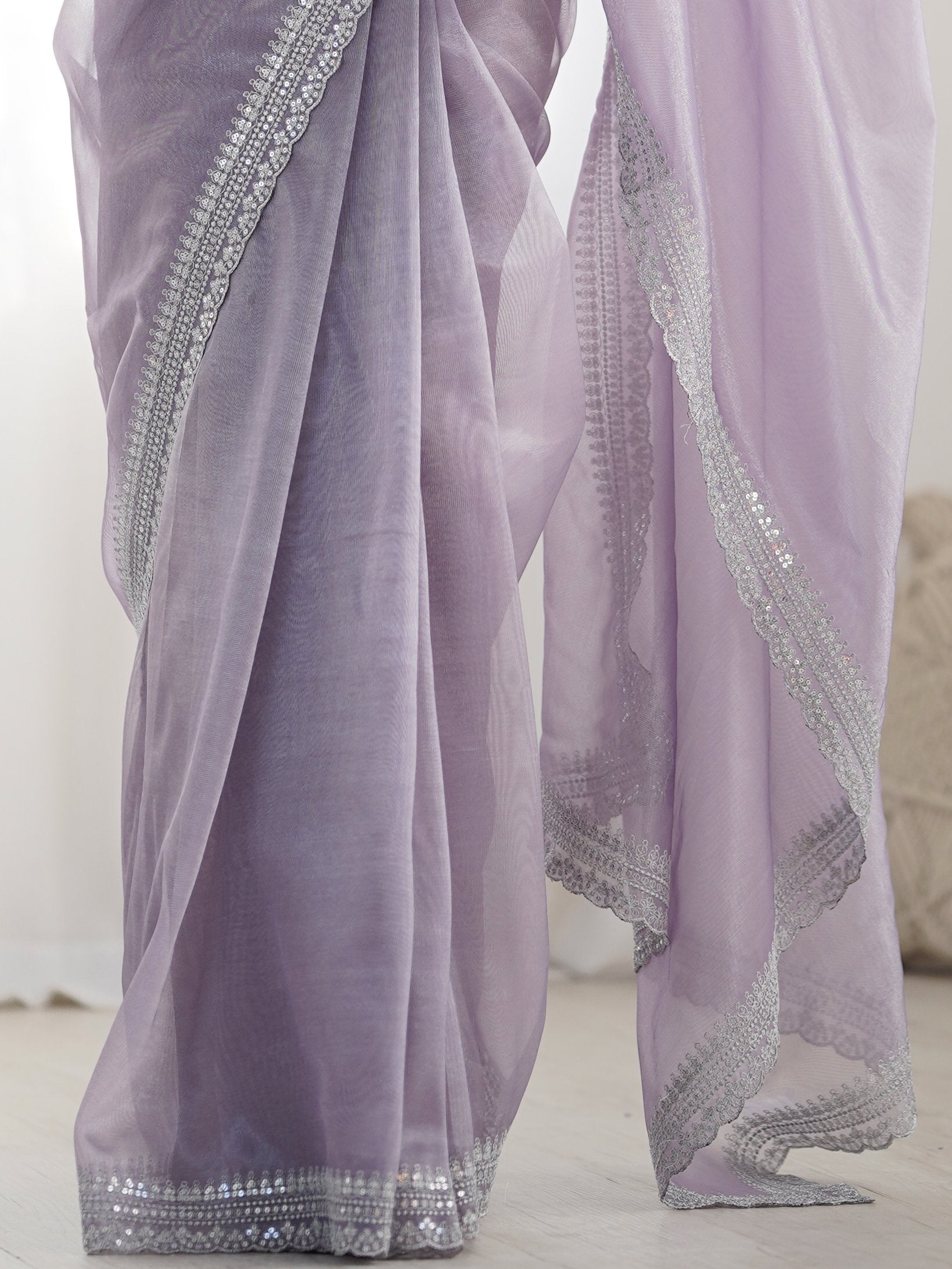 Stunning Lavender Sequins Border Work Net Saree With Blouse