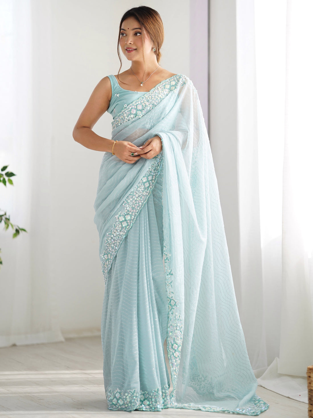 Attractive Sky Blue Sequins Georgette Reception Wear Saree With Blouse