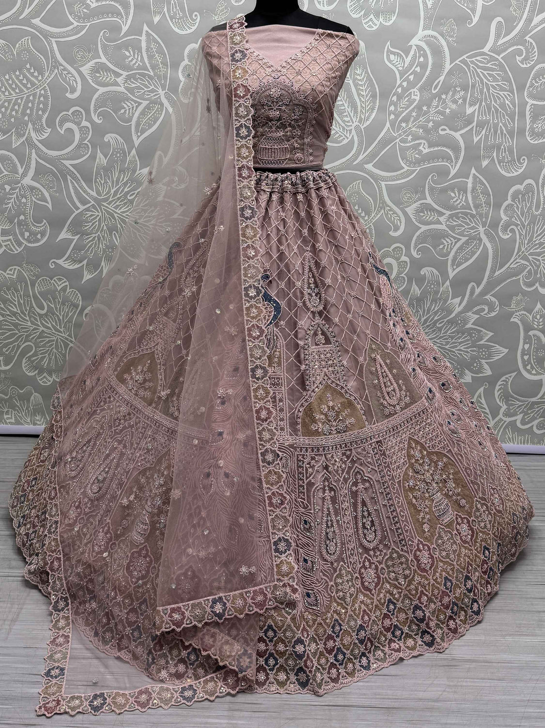 Beautiful Peach Sequins Net Engagement Wear Lehenga Choli