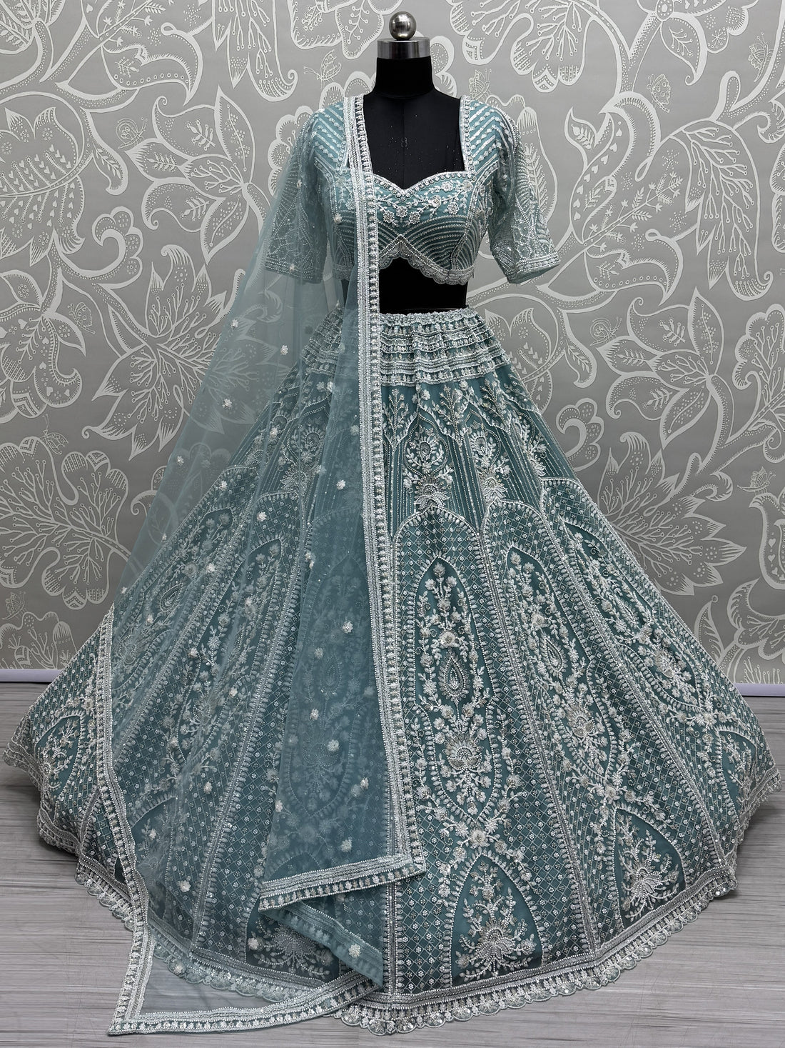 Astonishing Sky Blue Sequins Net Engagement Wear Lehenga Choli