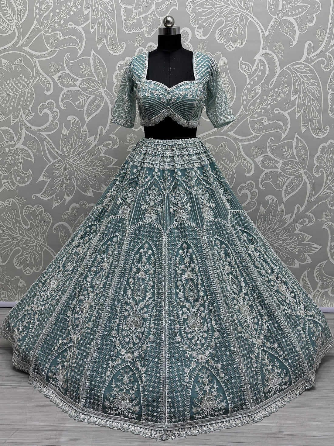Astonishing Sky Blue Sequins Net Engagement Wear Lehenga Choli