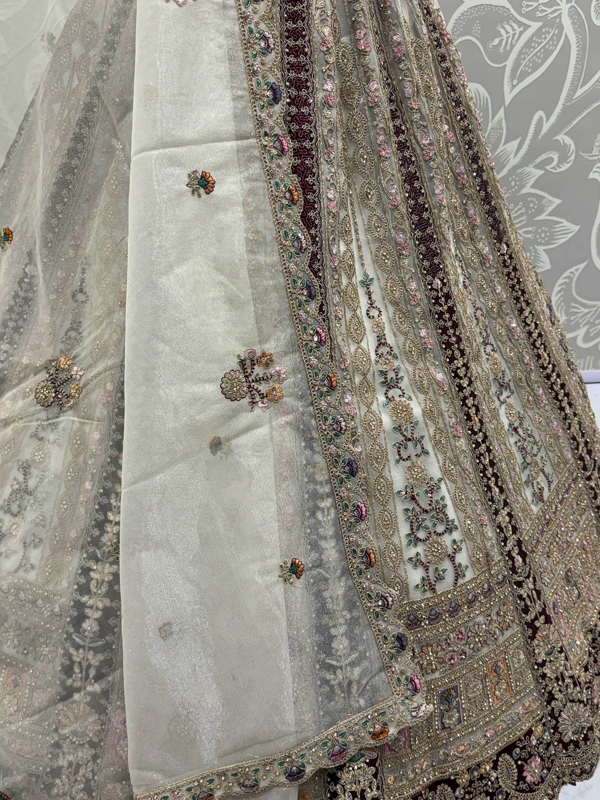 Great Off-White Stone Work Net Wedding Wear Lehenga Choli With Dupatta
