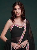Discover elegance with this exquisite black georgette long suit, featuring intricate lacework that adds a touch of refinement.  The suit is fully stitched and available in sizes XS to XXL, offering a perfect fit and a sophisticated silhouette. Its timeless black color ensures versatility, making it a standout choice for festivals, functions, and special events. The ensemble is completed with matching black georgette pants and a dupatta, adorned with beautiful border lace work.  This coordinated design enhan